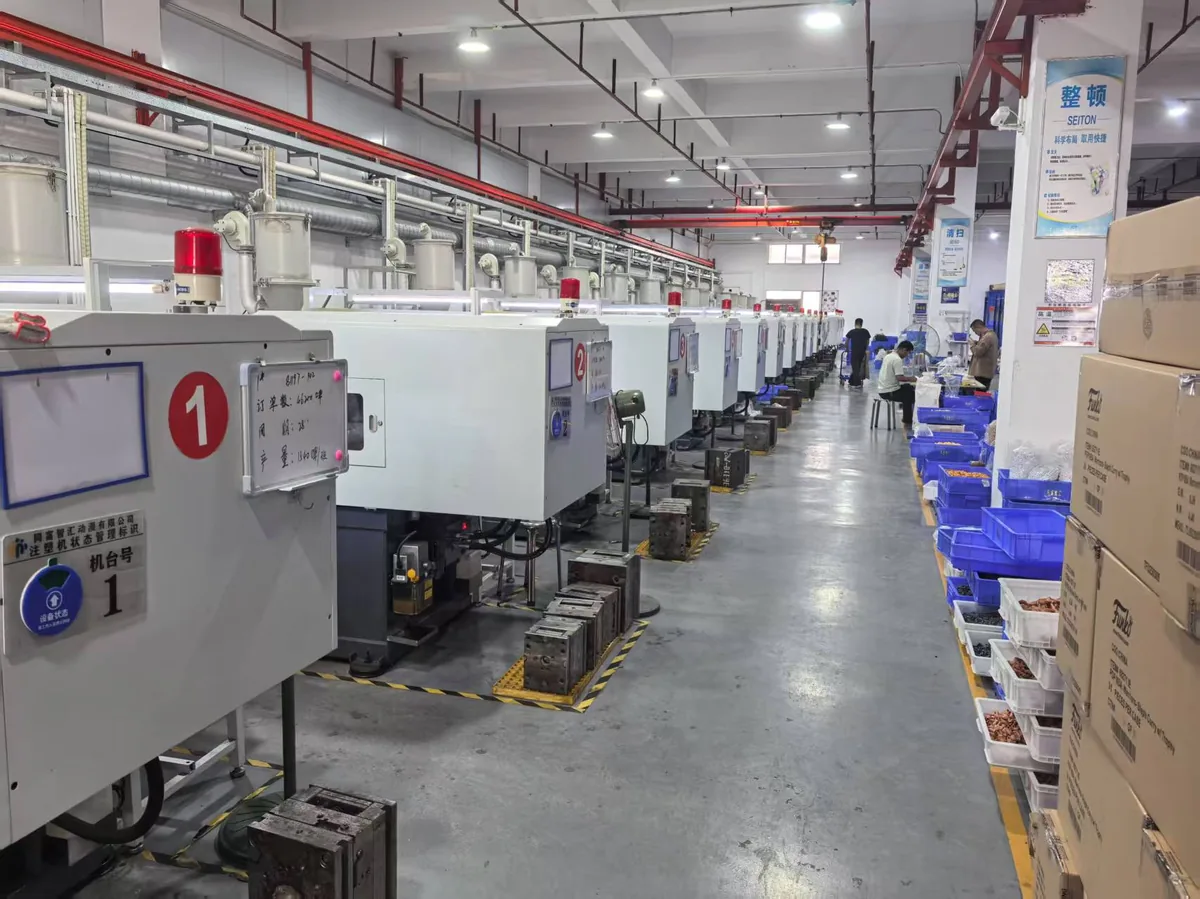 Injection molding workshop — line of CNC injection machines