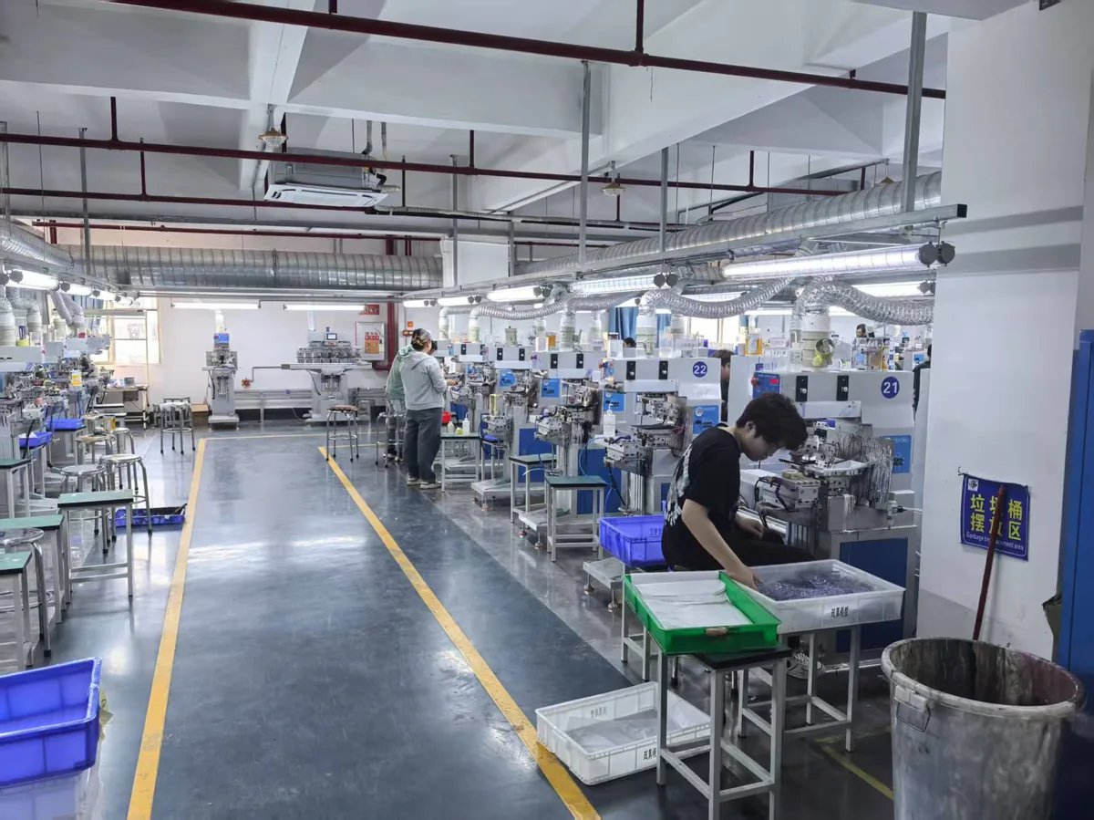 Pad printing workshop — operator at multi-station line